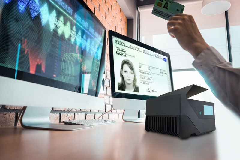 Id scanner connected to two desktop screens for automatic identity verfication.