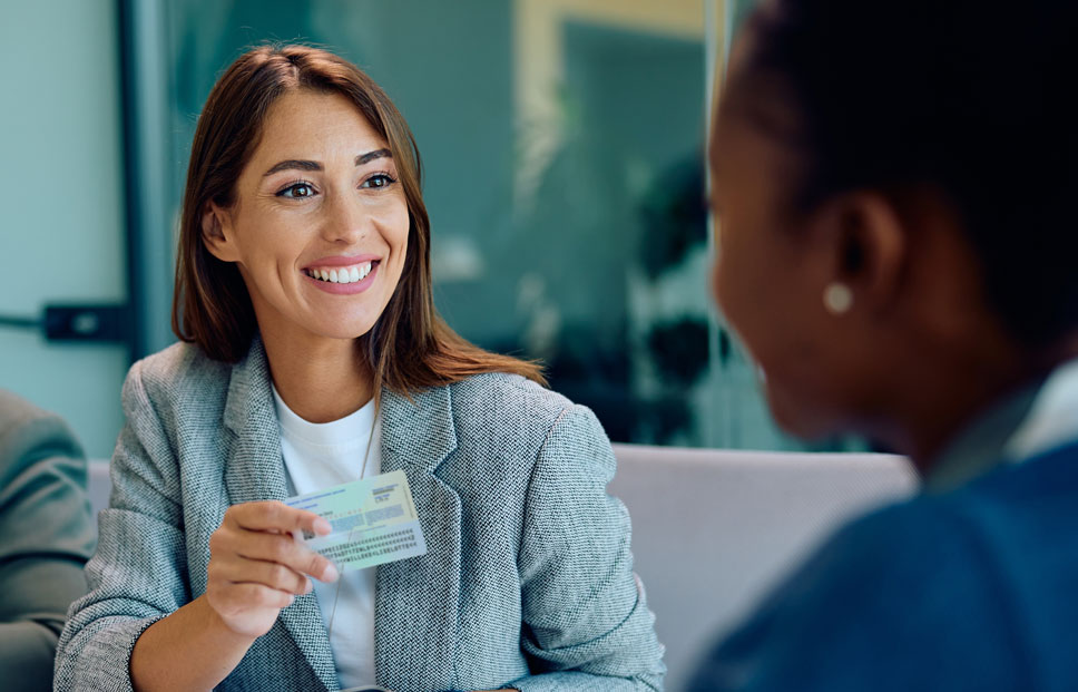 women checking id card and verifying the identity of candidate during recruitment, identity verification for pre-employment.